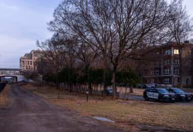 Minneapolis Park Police park near the location of an encampment that was cleared earlier in the day.