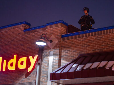 Minneapolis Police Officer on Holiday Gas Roof, 36th & Cedar