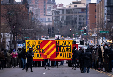 Protesters march against fascism in downtown St. Paul. The protesters marched through downtown with large banners.