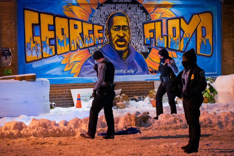 Minneapolis Police and the George Floyd Mural 3 Officers look for evidence inside George Floyd Square after responding to a shooting on December 27, 2020.