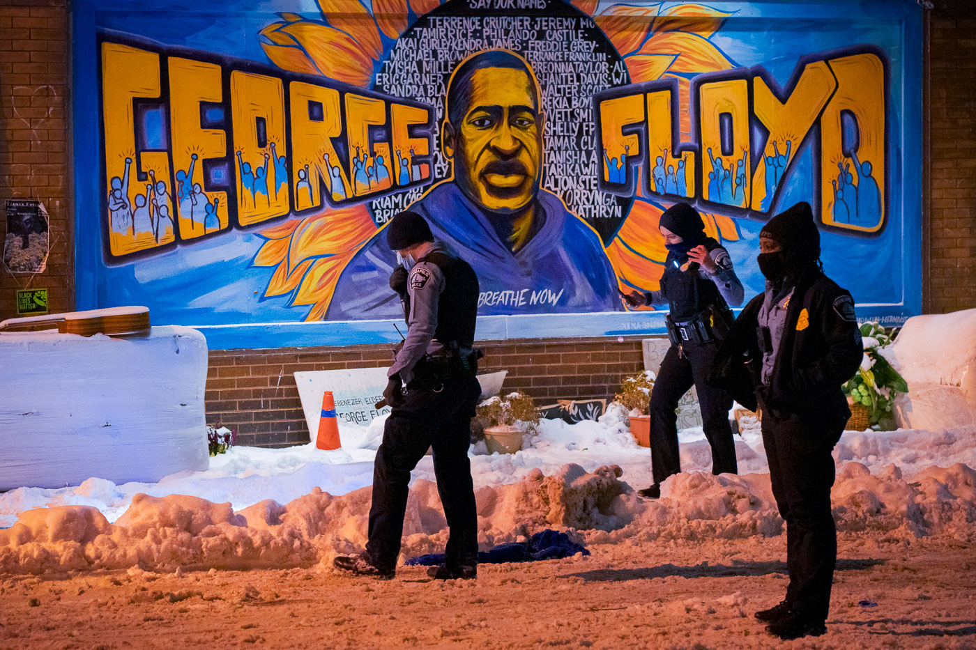 Police in front of George Floyd mural