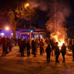 Protesters around a fire in the street 4 Protesters gather in the street outside the gas station where Minneapolis police killed Dolal Idd. Earlier in the year George Floyd was killed a mile away.
