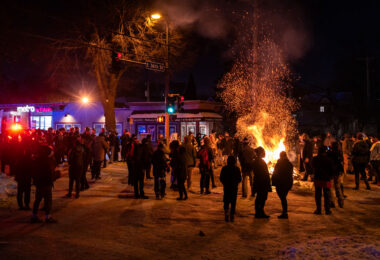 Protesters gather in the street outside the gas station where Minneapolis police killed Dolal Idd. Earlier in the year George Floyd was killed a mile away.