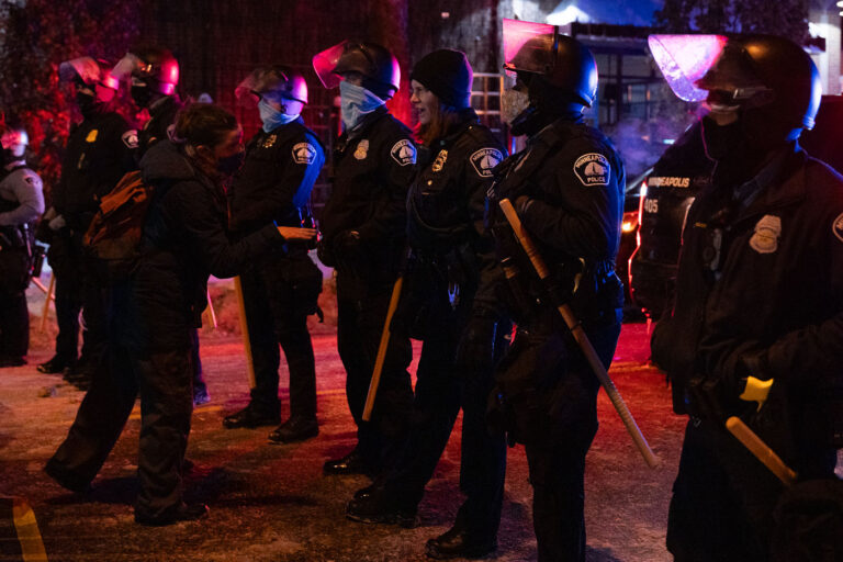 Minneapolis Police at Dolal Idd protest 4 Protesters and police outside the gas station that Dolal Idd was killed earlier in the day.