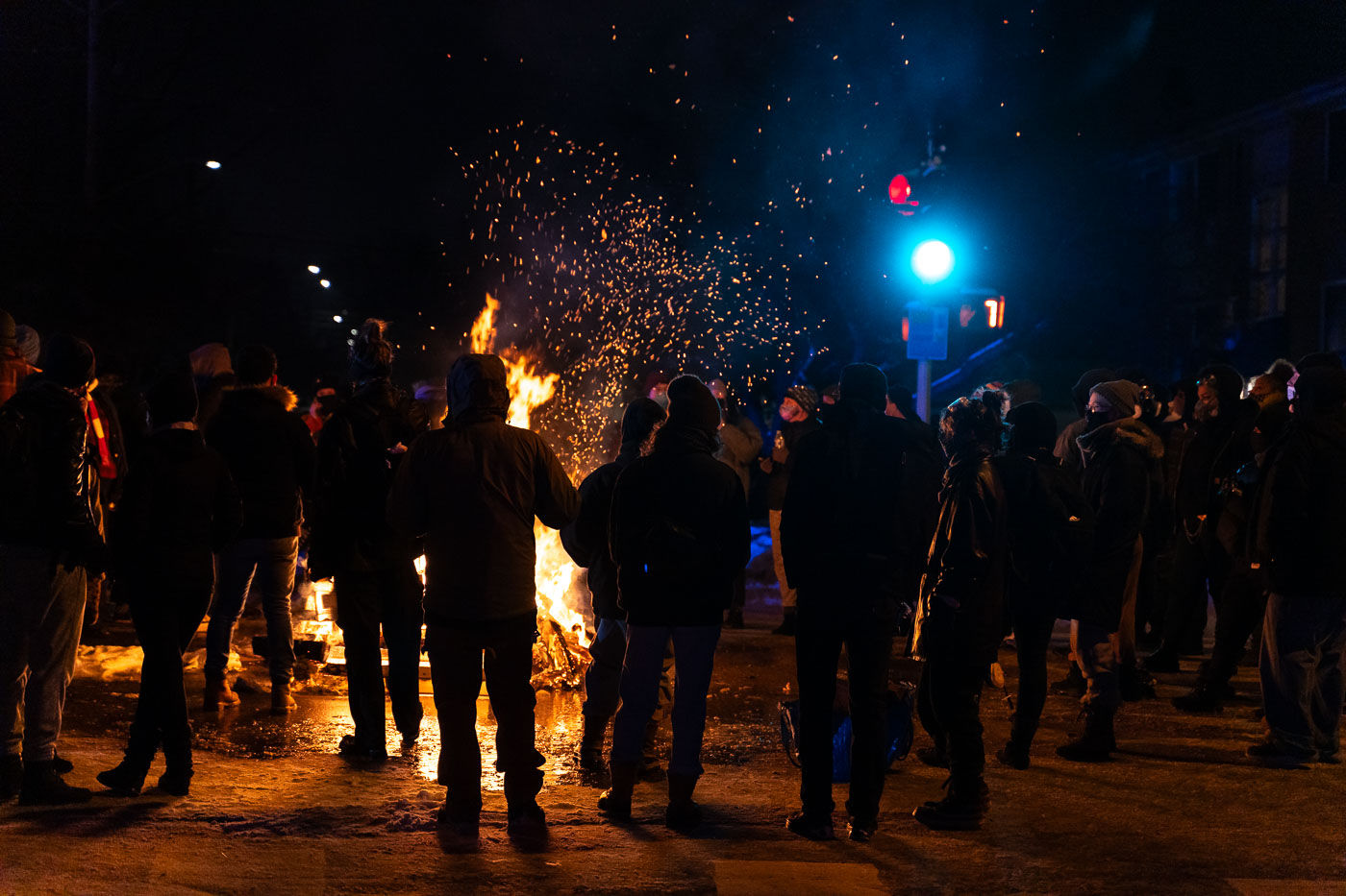 Protesters around a fire after Dolal Idd was killed