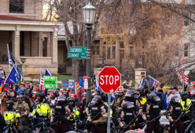 "Stop The Steal" protesters and the Minnesota State Patrol outside the Minnesota Governor's Residence in St. Paul on December 5, 2020.