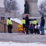 Minnesota State Patrol guards the State Capitol on reports of possible protests following a January 6th, 2021 insurrection at the United States Capitol. 3 Trump supporters at a rally.