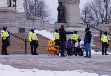 Minnesota State Patrol guards the State Capitol on reports of possible protests following a January 6th, 2021 insurrection at the United States Capitol. 3 Trump supporters at a rally.