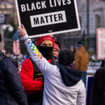 Black Lives Matter protesters at a Stop The Steal rally 1 Trump supporters and counter-protesters at the Minnesota Governor’s Residence after a “Storm The Capitol” event at the Minnesota State Capitol.