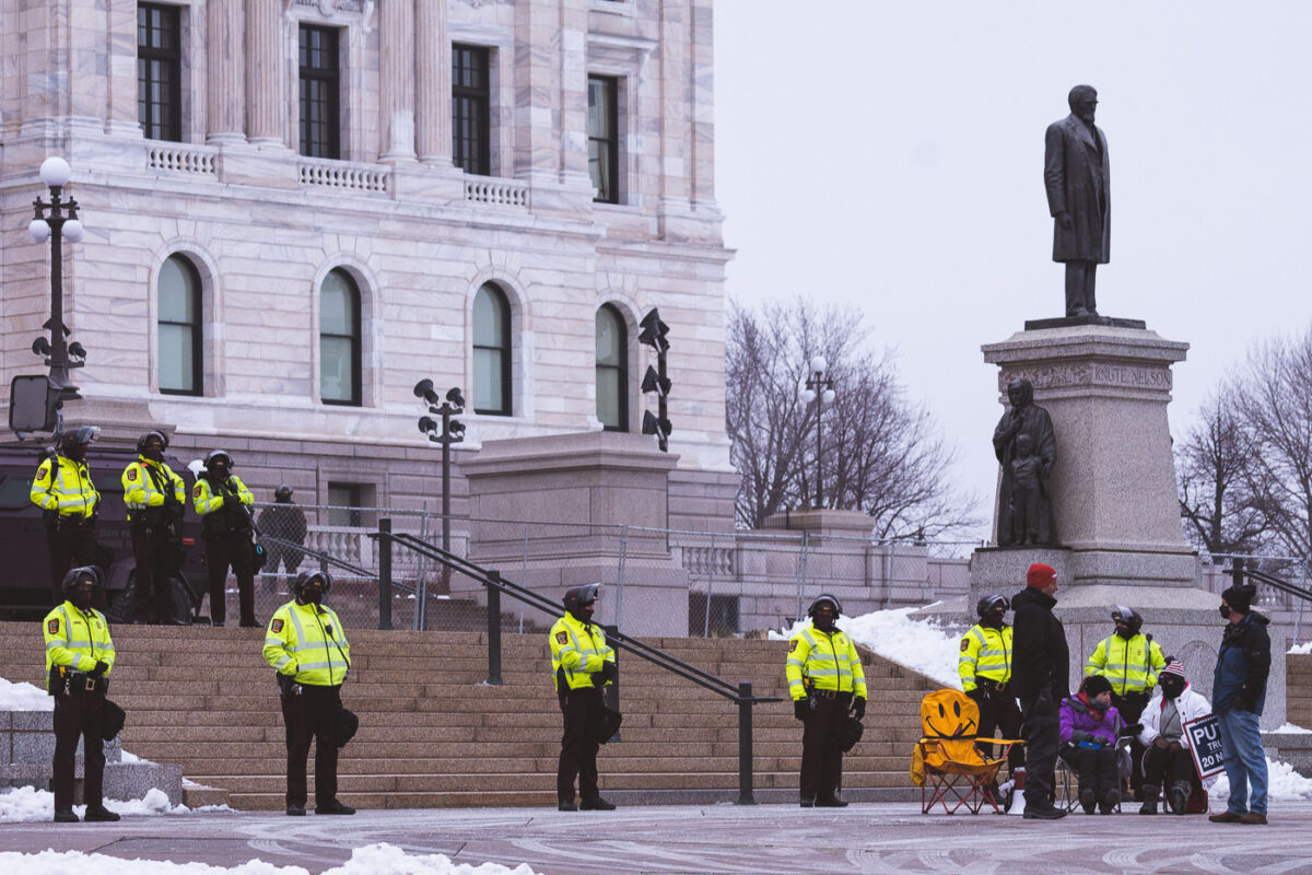 Minnesota State Patrol guards the State Capitol on reports of possible protests following a January 6th, 2021 insurrection at the United States Capitol. 3 Trump supporters at a rally.