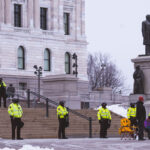 Minnesota State Patrol guards the State Capitol on reports of possible protests following a January 6th, 2021 insurrection at the United States Capitol. 3 Trump supporters at a rally.