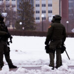 Law enforcement guards the Minnesota State Capitol.