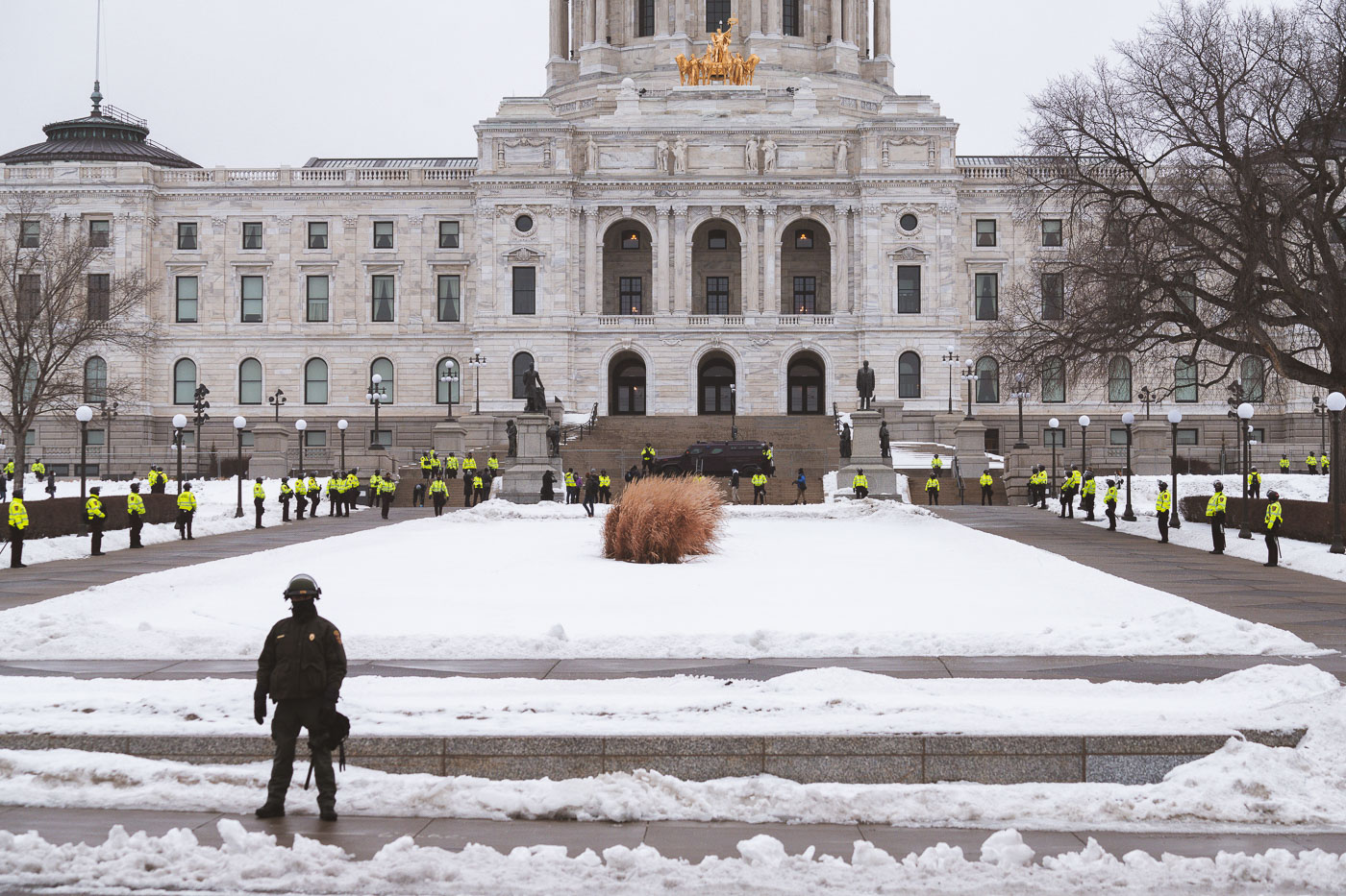 MN State Capitol surrounded by State Troopers