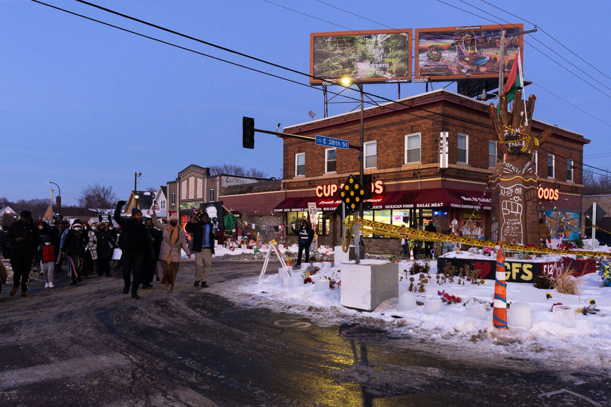 Protesters march to George Floyd Square from where Dolal Idd was killed about a mile away.