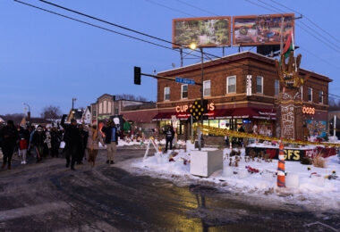 Protesters march to George Floyd Square from where Dolal Idd was killed about a mile away.