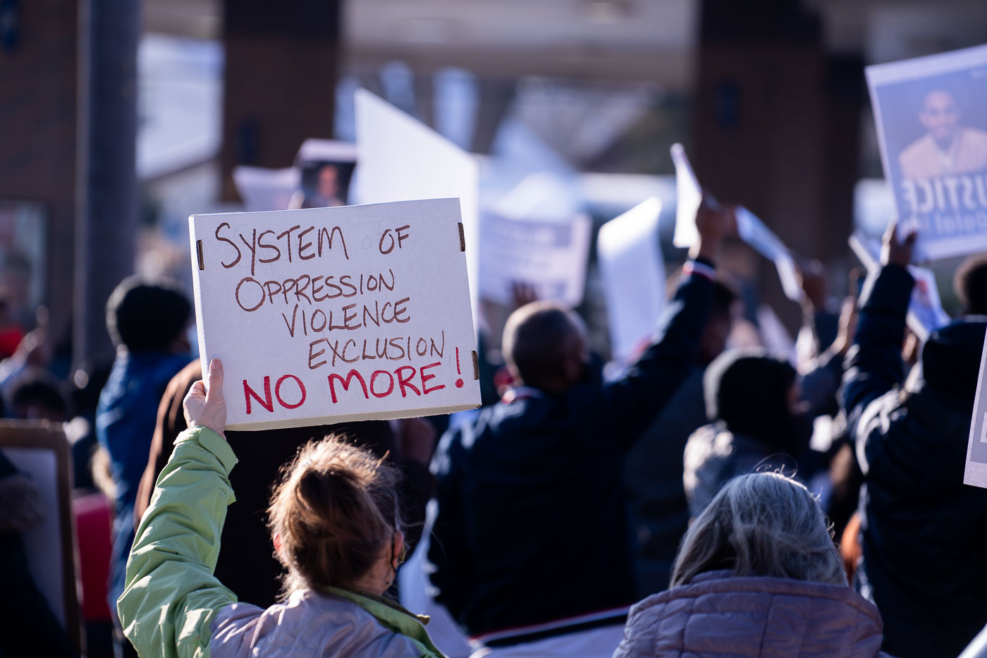 System of Oppression Violence Exclusion Protest Sign