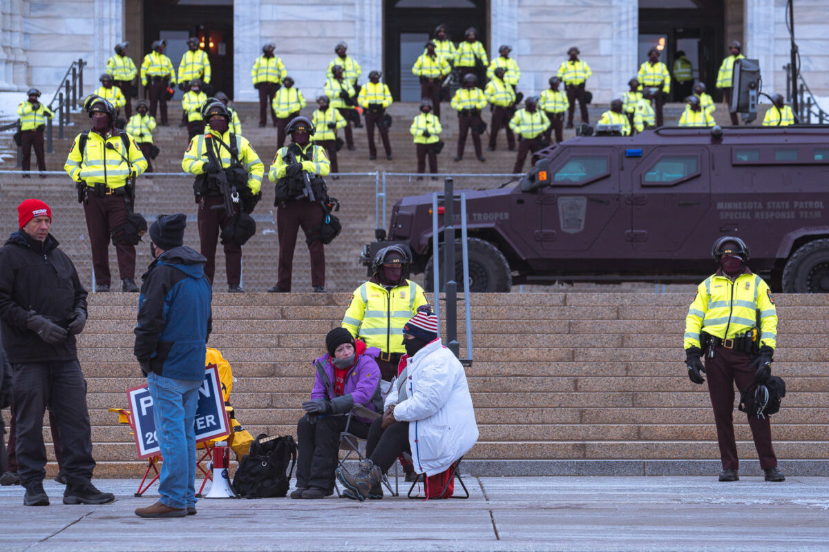 Minnesota State Patrol guards the State Capitol on reports of possible protests following a January 6th, 2021 insurrection at the United States Capitol. 3 Trump supporters at a rally.