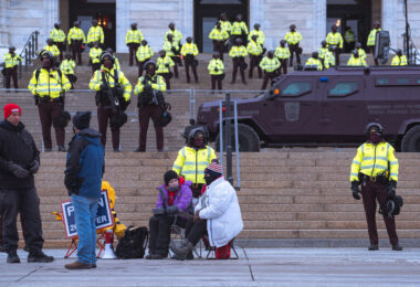 Minnesota State Patrol guards the State Capitol on reports of possible protests following a January 6th, 2021 insurrection at the United States Capitol. 3 Trump supporters at a rally.