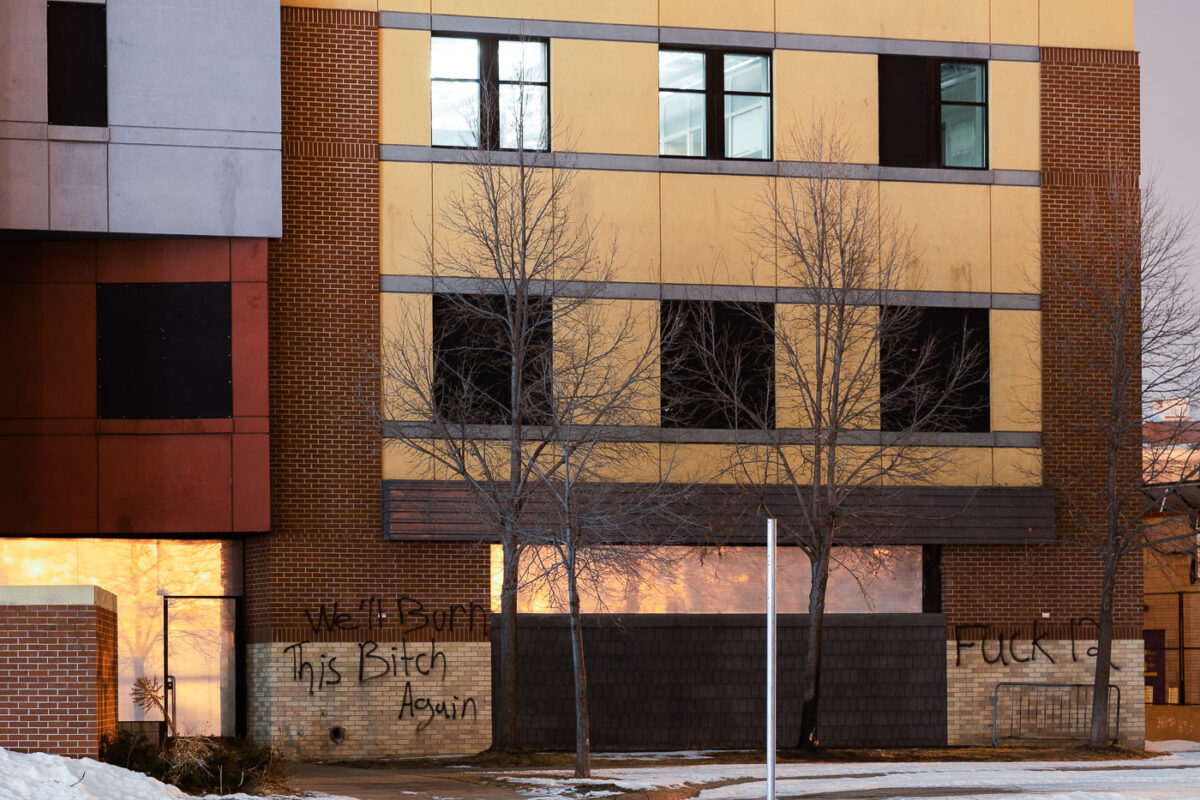 Graffiti on the Minneapolis Police third precinct that reads "We'll burn this bitch again" and "Fuck 12". The precinct has been vacant since it was abandoned by the Minneapolis Police and burned by protesters on May 28th, 2020.