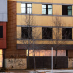 Graffiti on the Minneapolis Police third precinct that reads "We'll burn this bitch again" and "Fuck 12". The precinct has been vacant since it was abandoned by the Minneapolis Police and burned by protesters on May 28th, 2020.