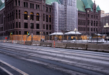 Minneapolis City Hall and the Hennepin County Government Center with security fencing and boards in preparation for the Derek Chauvin murder trial.
