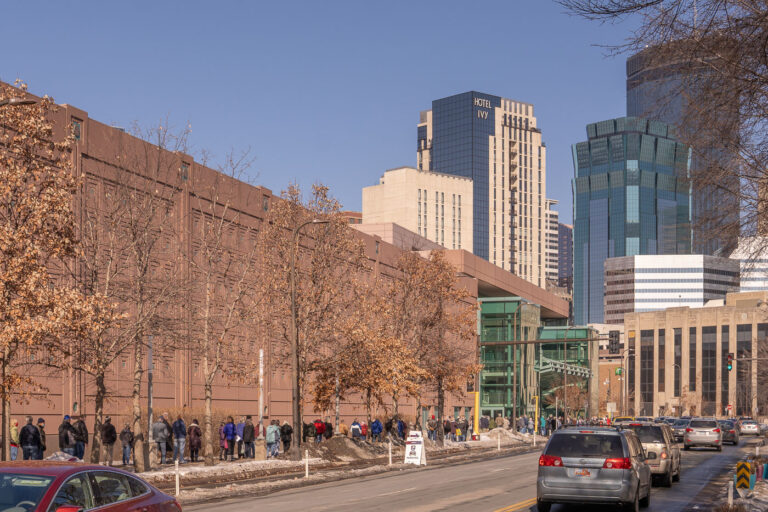 Line for COVID vaccine 1 People stand in line for their turn to get the COVID-19 vaccine at the Minneapolis Convention Center.