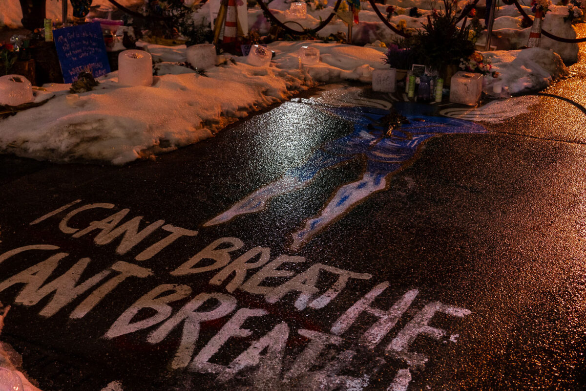 Rare winter rainfall covering the George Floyd Memorial with ice.