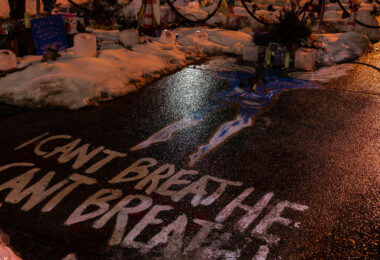 Rare winter rainfall covering the George Floyd Memorial with ice.