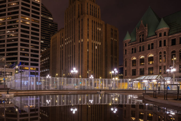 Reflections outside Minneapolis City Hall and Government Center 2 Security fencing being installed around the courthouse that will hold the Derek Chauvin murder trial over the death of George Floyd. Jury selection is to begin March 8th.