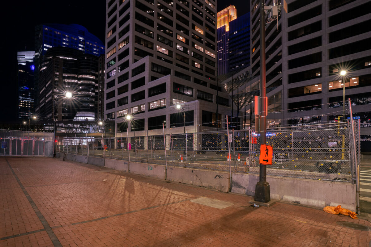 Locks of police violence victims hang on the security fencing around the Hennepin County Government Center.