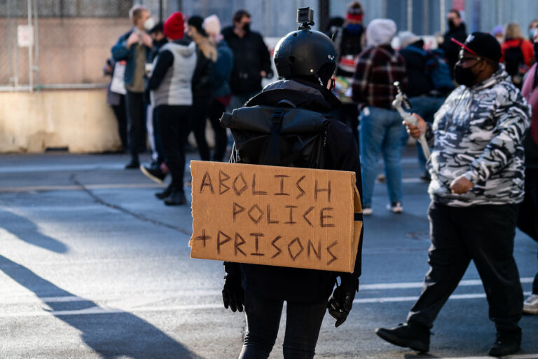 Abolish Police and Prisons protest sign 3 Protesters gathered outside the Hennepin County Government Center prior to the 8am start of the Derek Chauvin trial. Former Minneapolis Police Officer Derek Chauvin is charged in the murder of George Floyd on May 25th, 2020.