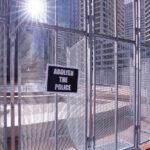 An Abolish The Police protest sign on the security fencing around the Hennepin County Government Center where Derek Chauvin is on trial for the May 25, 2020 murder of George Floyd in South Minneapolis.