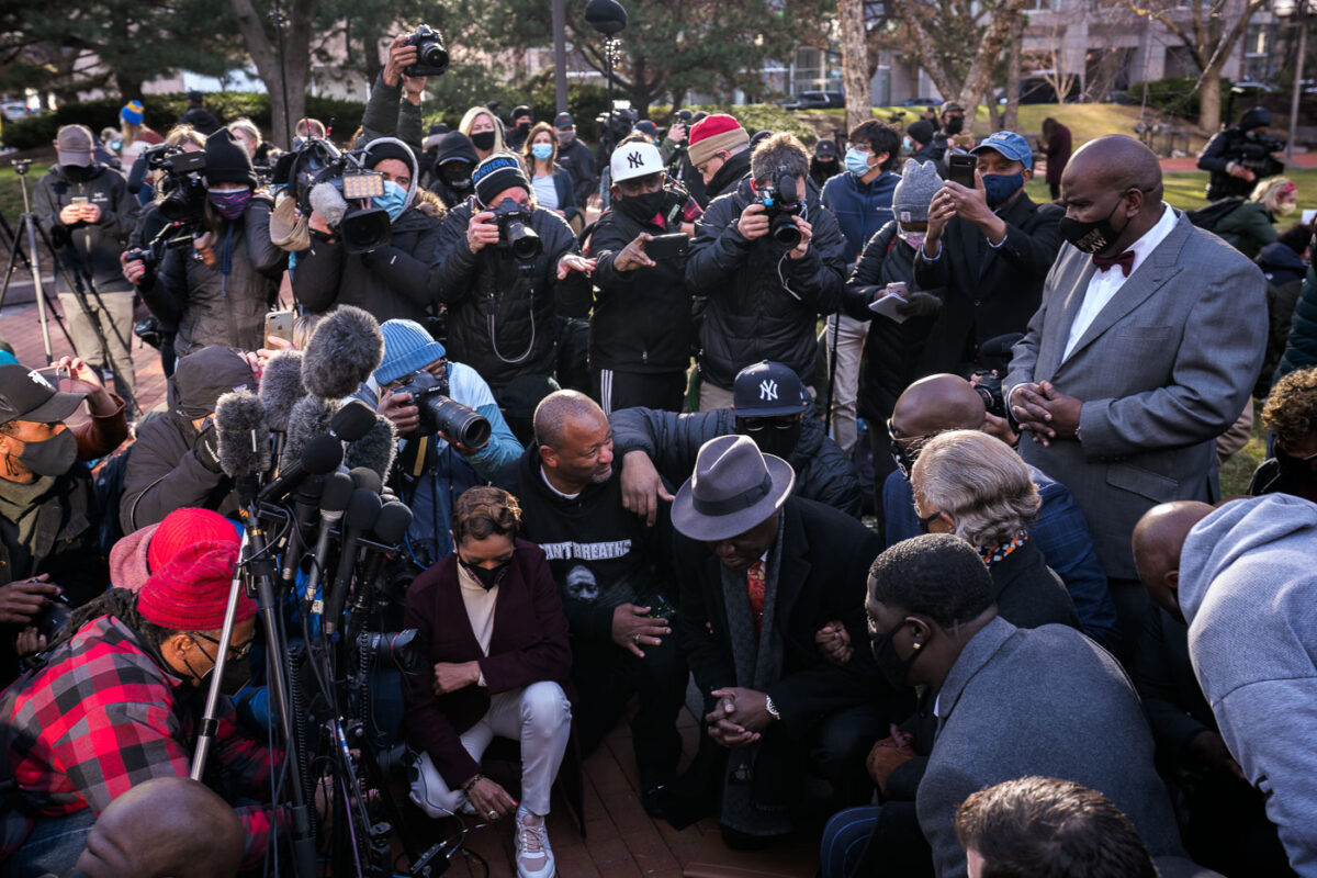 March 29, 2021 - Minneapolis -- Ben Crump, the attorney for the George Floyd, Rev. Al Sharpton, and George Floyd Family take a kneel for 8:46 outside the Hennepin County Government Center prior to opening statements began in the Derek Chauvin murder trial. Chauvin is accused of murdering George Floyd on May 25th, 2020.