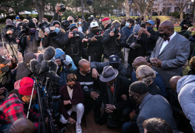 March 29, 2021 - Minneapolis -- Ben Crump, the attorney for the George Floyd, Rev. Al Sharpton, and George Floyd Family take a kneel for 8:46 outside the Hennepin County Government Center prior to opening statements began in the Derek Chauvin murder trial. Chauvin is accused of murdering George Floyd on May 25th, 2020.