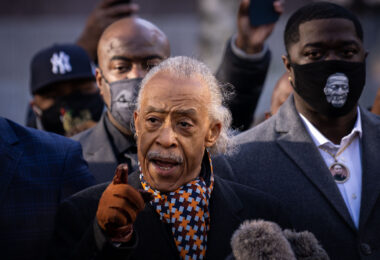 Rev Al Sharpton speaks outside the Hennepin County Government Center where opening statements of the Derek Chauvin trial were set to begin. He's joined by George Floyd's brothers Philonise and Terrence Floyd.