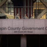 Armed security on courthouse balcony during Chauvin trial 3 National Guard guarding the Government Center.