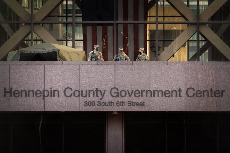 Armed security on courthouse balcony during Chauvin trial 3 National Guard guarding the Government Center.