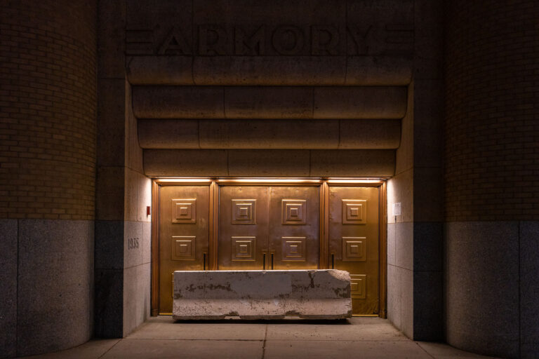 Armory with a barricade in front of door 4 Concrete barricades in front of doors at The Amory concert venue in downtown Minneapolis.