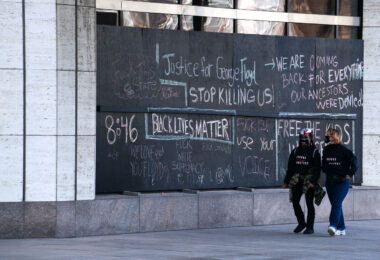 Protesters gathered outside the Hennepin County Government Center prior to the 8am start of the Derek Chauvin trial. Former Minneapolis Police Officer Derek Chauvin is charged in the murder of George Floyd on May 25th, 2020.