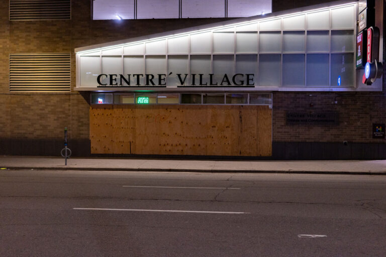Centre Village boarded up in Downtown Minneapolis 1 Centre Village, a mixed-use development in downtown Minneapolis, is seen boarded up. The building houses a Hyatt Place hotel and offices and condominiums. The plywood covering suggests damage or security measures taken in response to events such as the Minneapolis Uprising in late May 2020, which saw widespread protests and unrest in the city. The presence of an ATM sign indicates the building's commercial function.