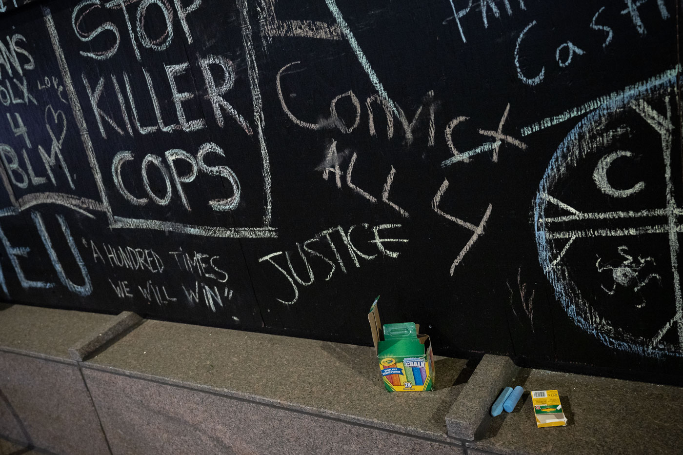 Chalk outside US Bank Plaza boards