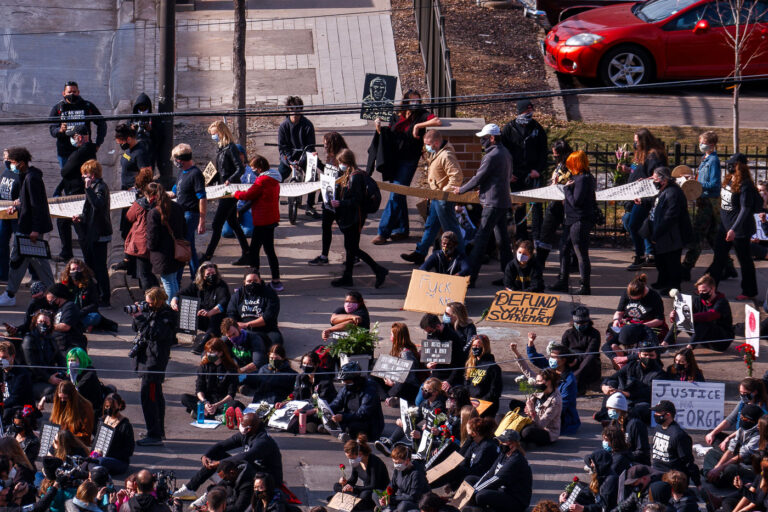 Defund White Supremacy protest sign 2 Thousands march the day before the start of jury selection in the Derek Chauvin murder trial. The former Minneapolis Police officer is charged with the murder of George Floyd on May 25th, 2020.