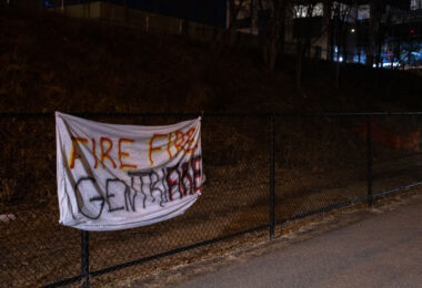 A protest sign seen on the Midtown Greenway that reads "Fire Fire Gentrifire"