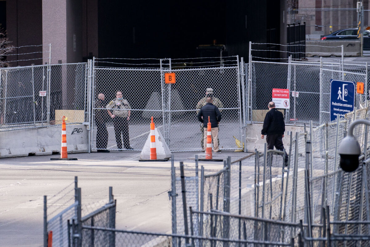 A man speaks through the fence to the Minnesota National Guard during the Derek Chauvin murder trial.