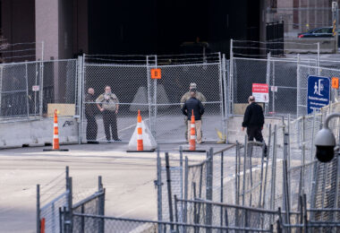 A man speaks through the fence to the Minnesota National Guard during the Derek Chauvin murder trial.