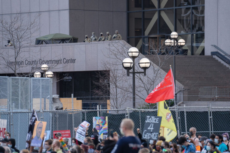 Hennepin County police look down on protesters at Chauvin trial 2 Protesters rally and march through Downtown Minneapolis on the day opening statements began in the Derek Chauvin murder trial. Chauvin is accused of murdering George Floyd on May 25th, 2020.