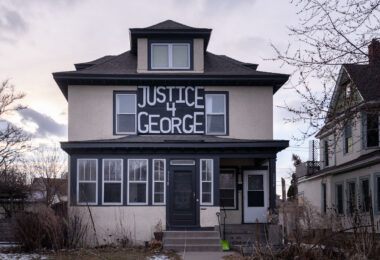 A sign reading "Justice 4 George" on a home in South Minneapolis.