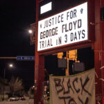 Justice for George Floyd. Trial in 3 days on the sign at The People's Way in George Floyd Square.