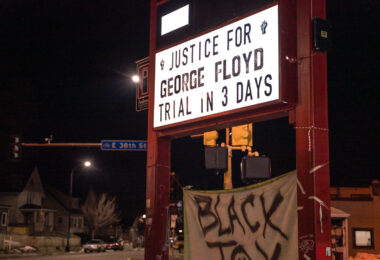 Justice for George Floyd. Trial in 3 days on the sign at The People's Way in George Floyd Square.