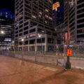 Locks of police violence victims hang on the security fencing around the Hennepin County Government Center.